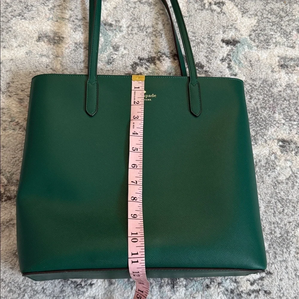 Kate Spade Brynn leather tote bag in the deep jade color with bow charm